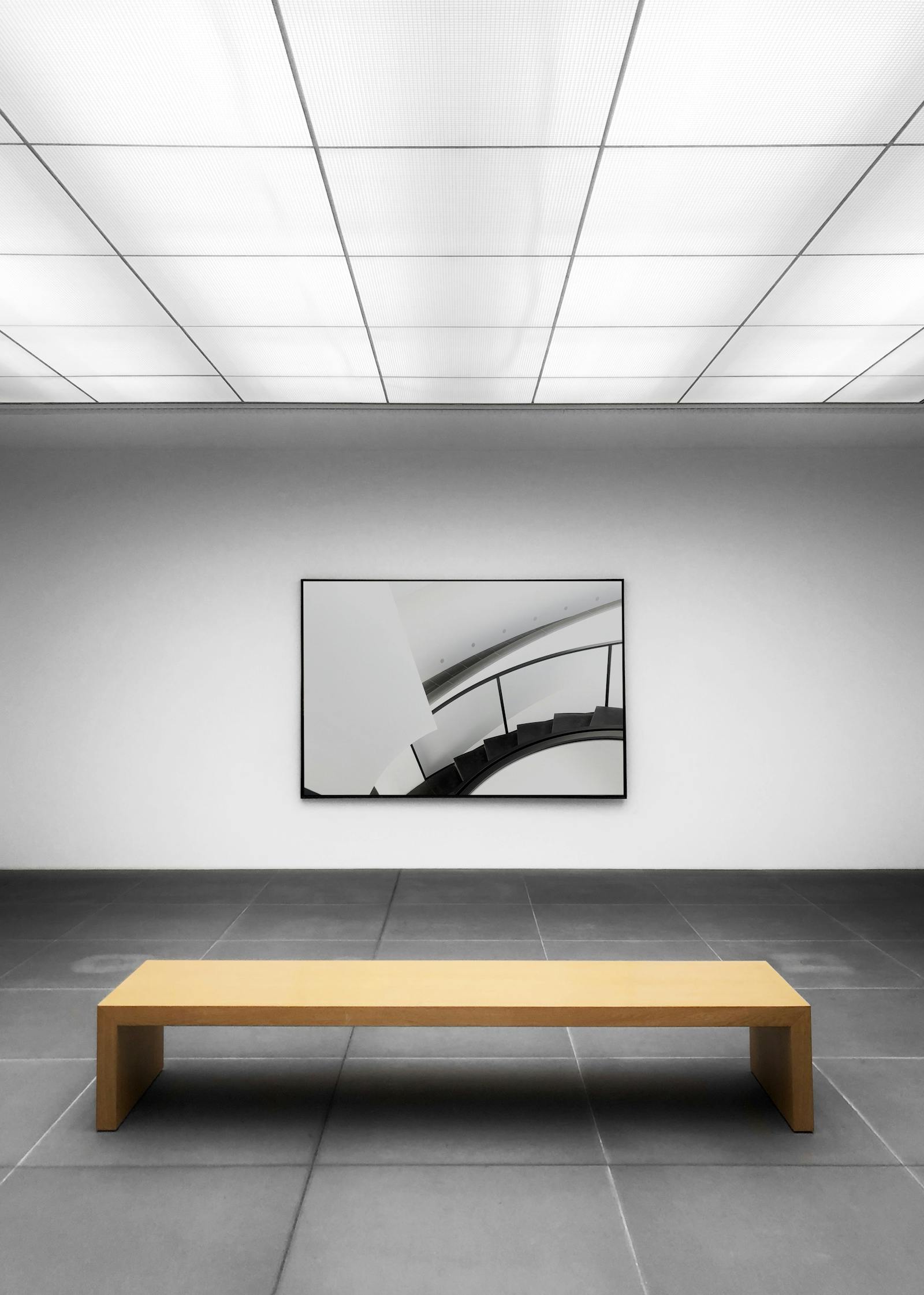 Minimalist art gallery with a single framed piece