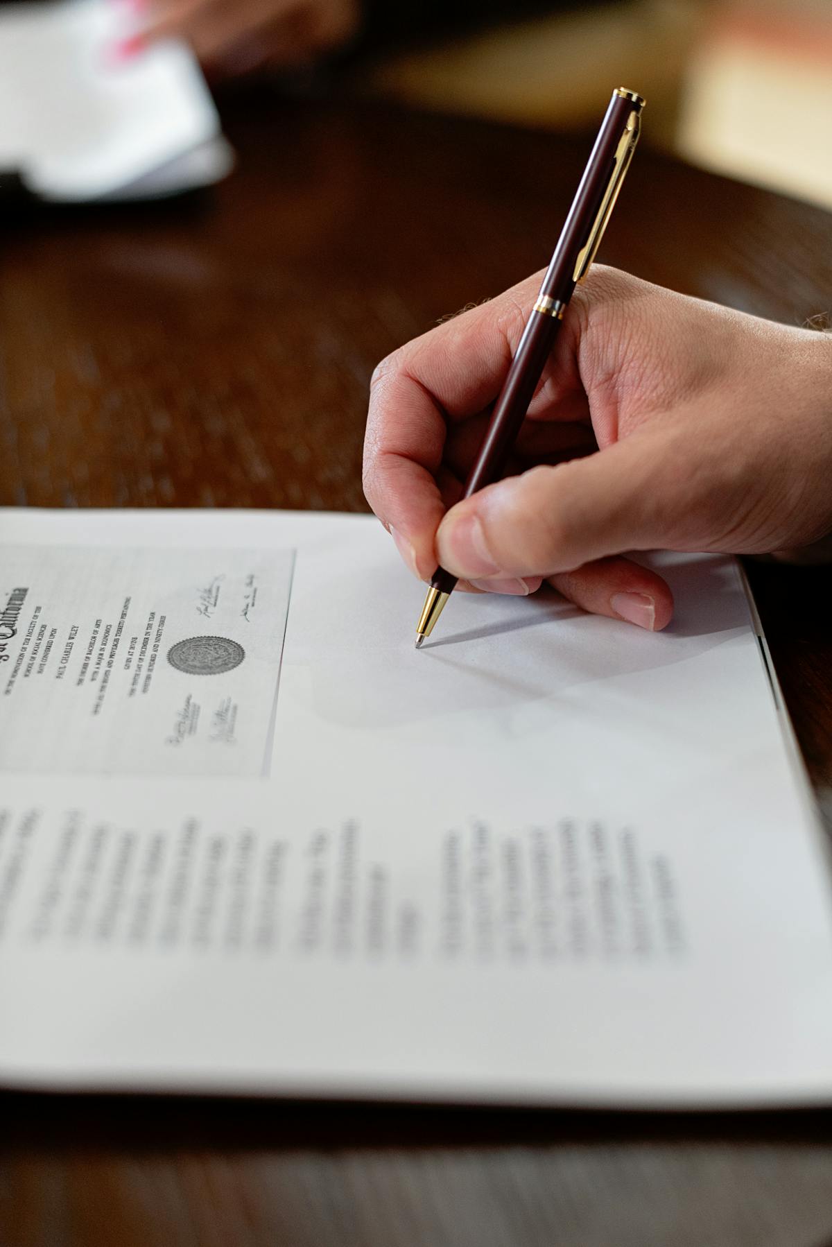 Closing signing agreement pen closeup