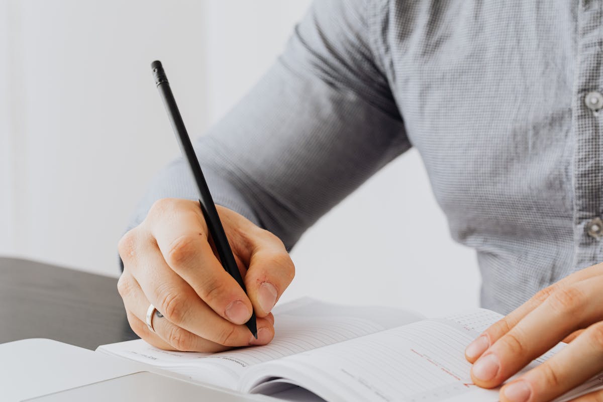General person writing notes meeting conference